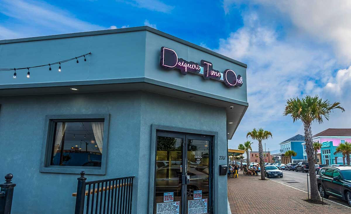 DTO photo of outside of DTO with sign at sunset